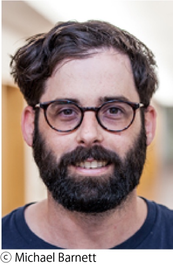 A person with a beard and glasses
            Description automatically generated with low confidence